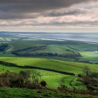 Panoramic view of Portand and Chesil Beach from the hill tops near Abbotsbury in Dorset, UK